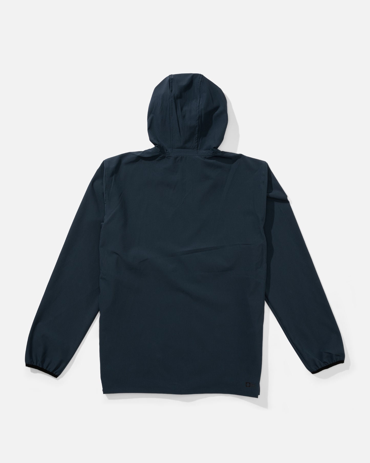 Back view of the Stowaway Windbreaker Jacket - Midnight Navy. 