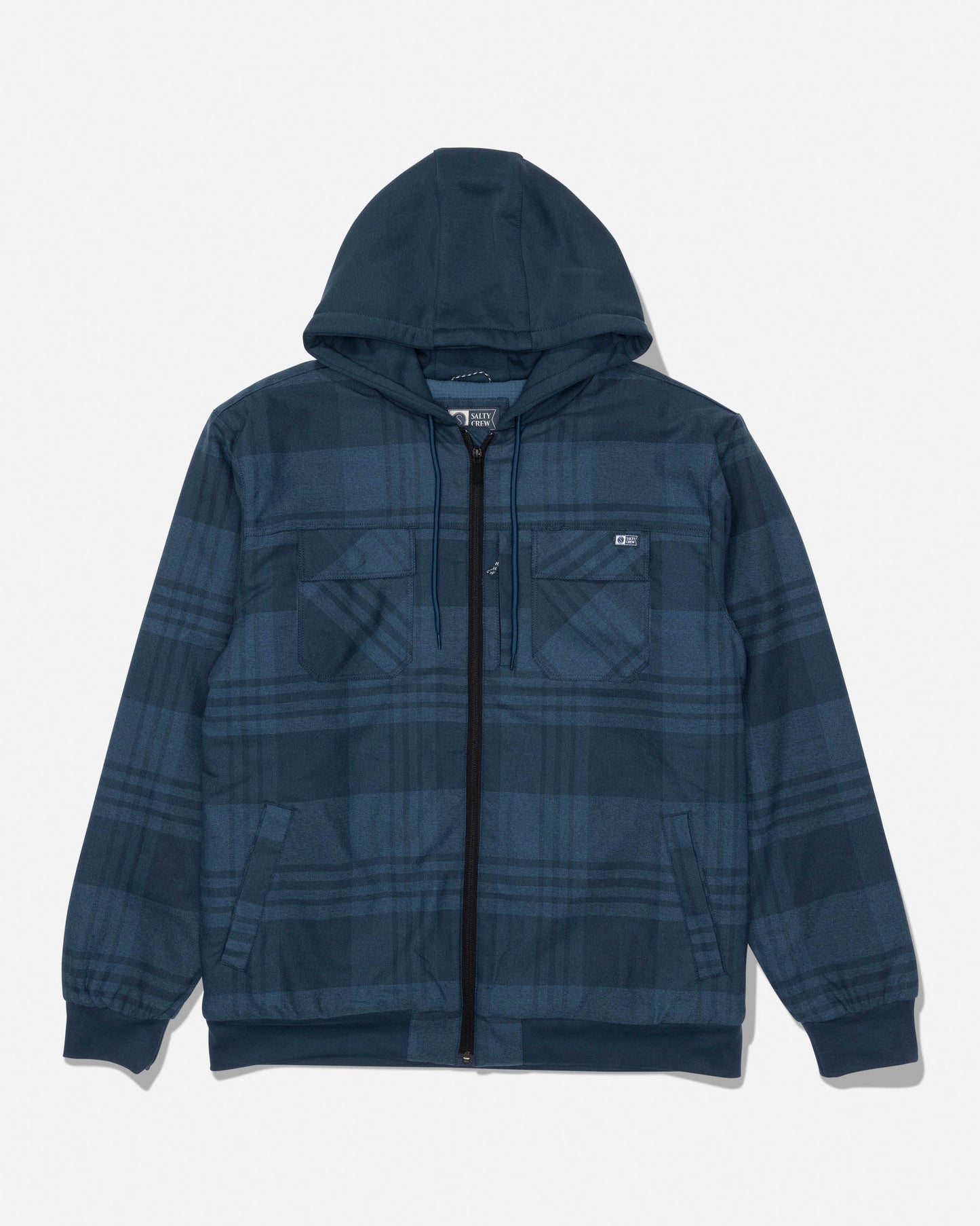The Salty Crew Fathom Jacket in Mid Blue is a plaid zip-up hoodie featuring two chest pockets, cuffed sleeves, and a front zipper closure. Crafted from mid-weight twill jacket material, it is shown laid flat on a white background.
