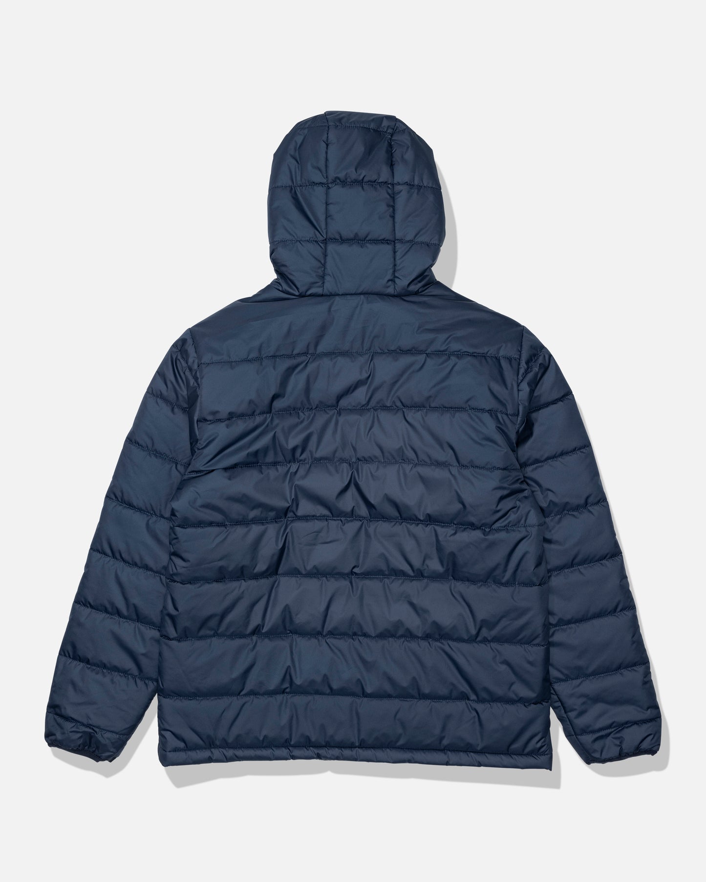 The Salty Crew Barrier Hooded Jacket in navy is shown from the back against a white background. This water-resistant jacket features horizontal quilting, long sleeves, and an insulated hood.