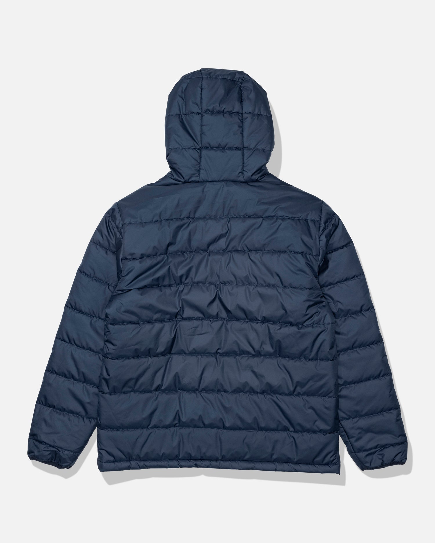 The Salty Crew Barrier Hooded Jacket in navy is shown from the back against a white background. This water-resistant jacket features horizontal quilting, long sleeves, and an insulated hood.