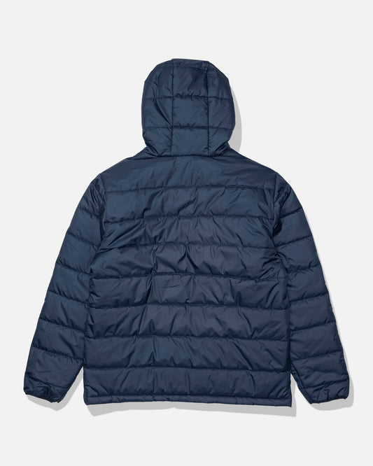 The Salty Crew Barrier Hooded Jacket in navy is shown from the back against a white background. This water-resistant jacket features horizontal quilting, long sleeves, and an insulated hood.