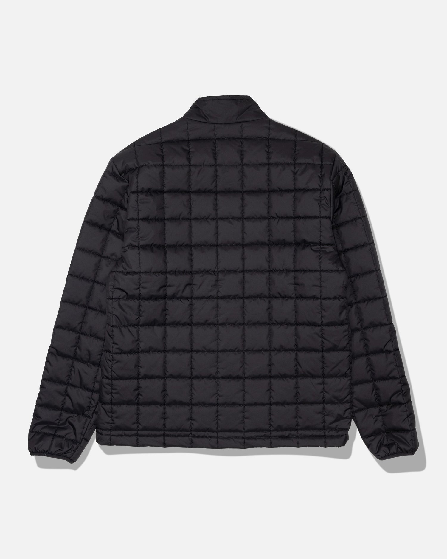 The Salty Crew Barrier Lite Jacket - Black is displayed from the back against a plain white background. This jacket features a black quilted grid pattern, long sleeves, and a simple collar, and is crafted with lightweight synthetic fill for comfort.