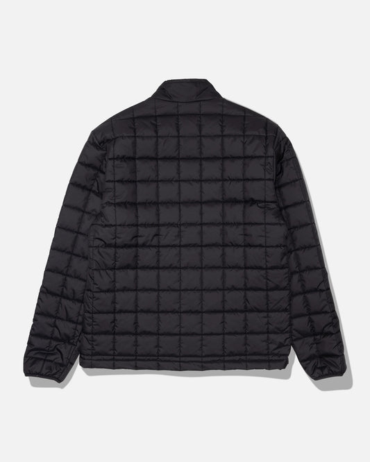 The Salty Crew Barrier Lite Jacket - Black is displayed from the back against a plain white background. This jacket features a black quilted grid pattern, long sleeves, and a simple collar, and is crafted with lightweight synthetic fill for comfort.