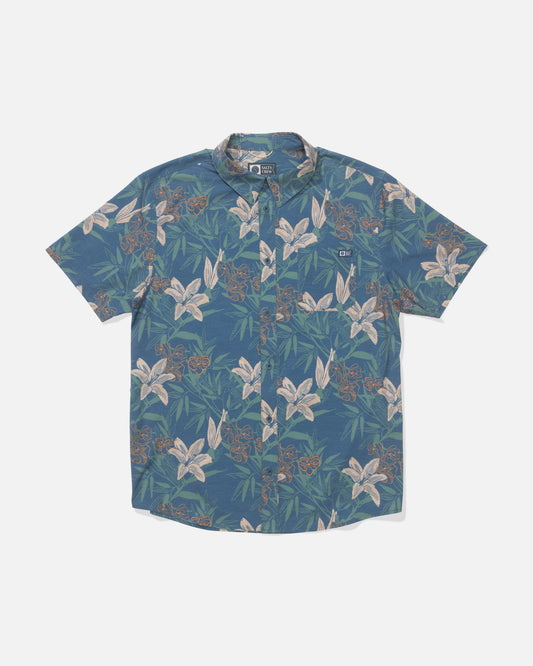 The Salty Crew Drifter UV Button Up in Cast Blue features UPF 50+ sun protection and a stylish floral print.