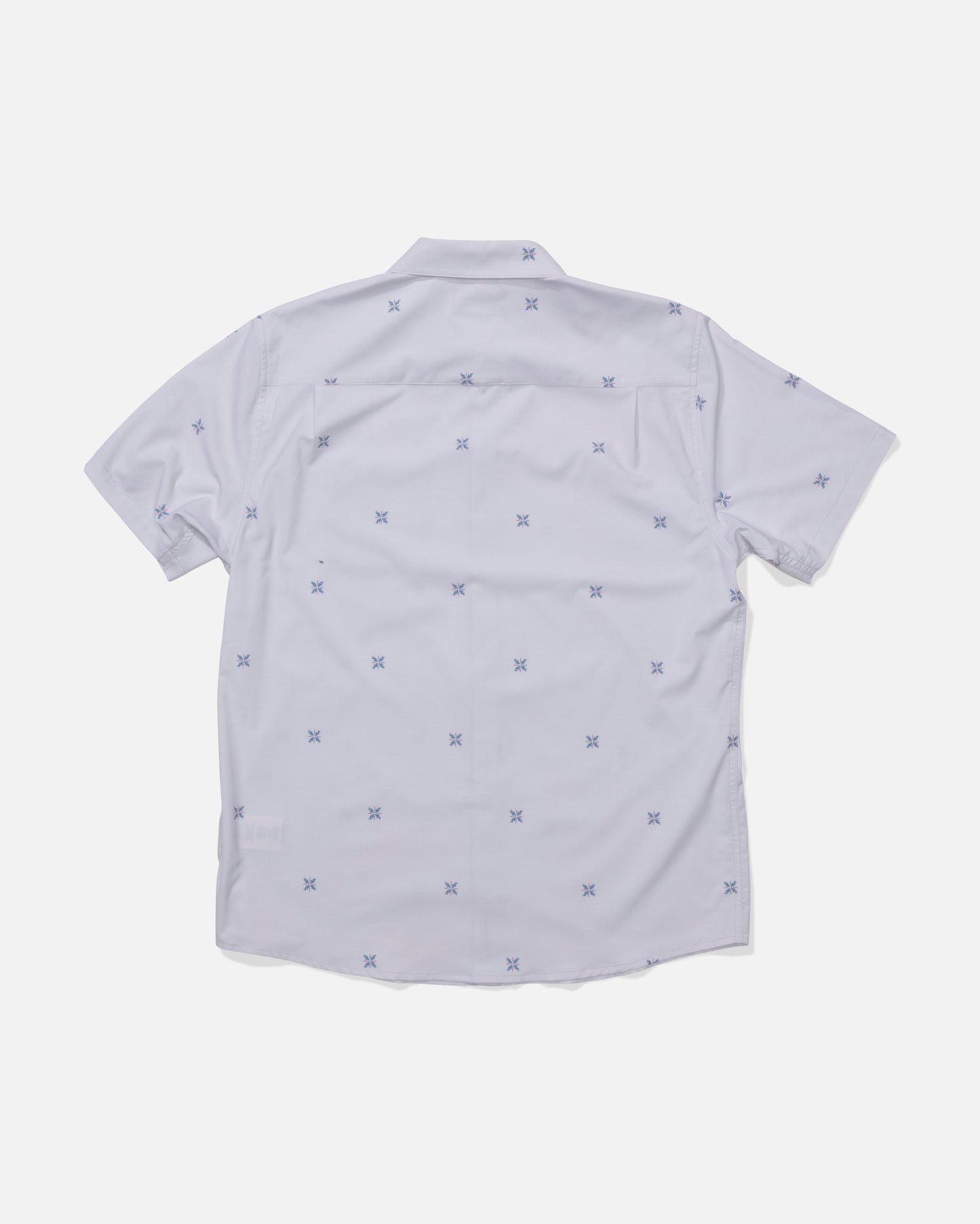 The Salty Crew Drifter UV Button Up in Light Grey is a short-sleeve shirt shown from the back, featuring a subtle pattern of small blue X shapes and enhanced with quick-dry fabric for comfort.