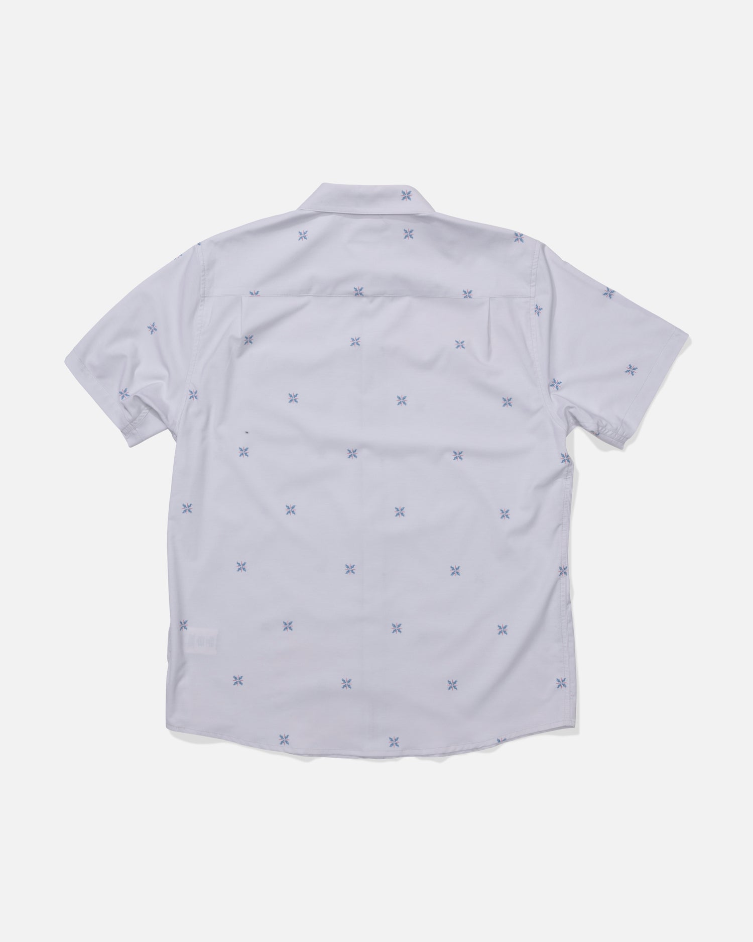 The Salty Crew Drifter UV Button Up in Light Grey is a short-sleeve shirt shown from the back, featuring a subtle pattern of small blue X shapes and enhanced with quick-dry fabric for comfort.