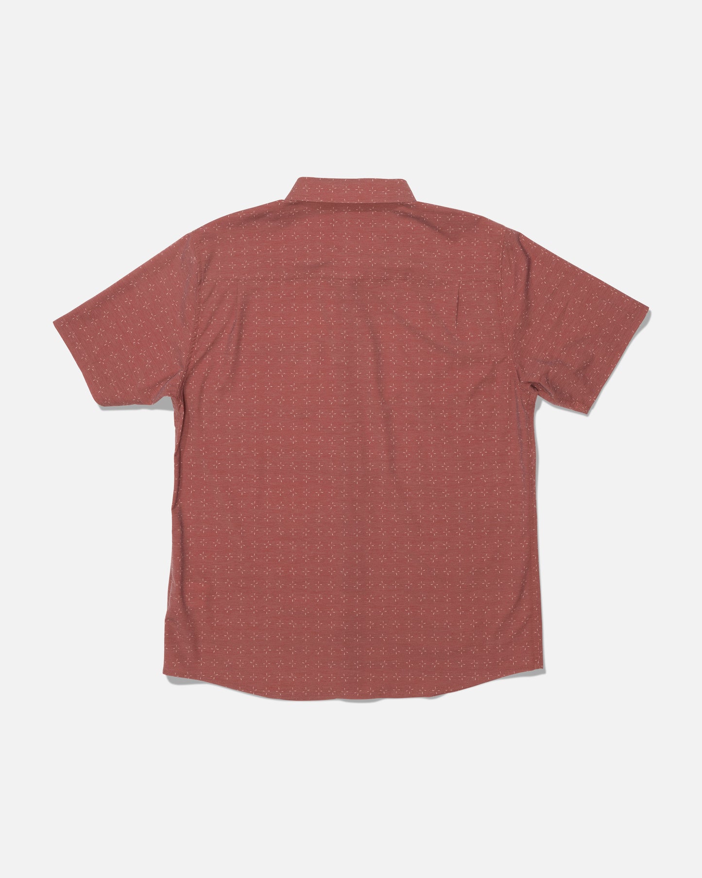 The Drifter UV Button Up by Salty Crew is a short-sleeve, button-up shirt in Mid Red with a subtle dotted pattern and UPF 50+ sun protection, shown from the back against a plain white background.