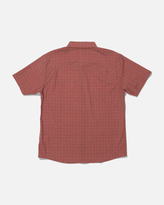 The Drifter UV Button Up by Salty Crew is a short-sleeve, button-up shirt in Mid Red with a subtle dotted pattern and UPF 50+ sun protection, shown from the back against a plain white background.