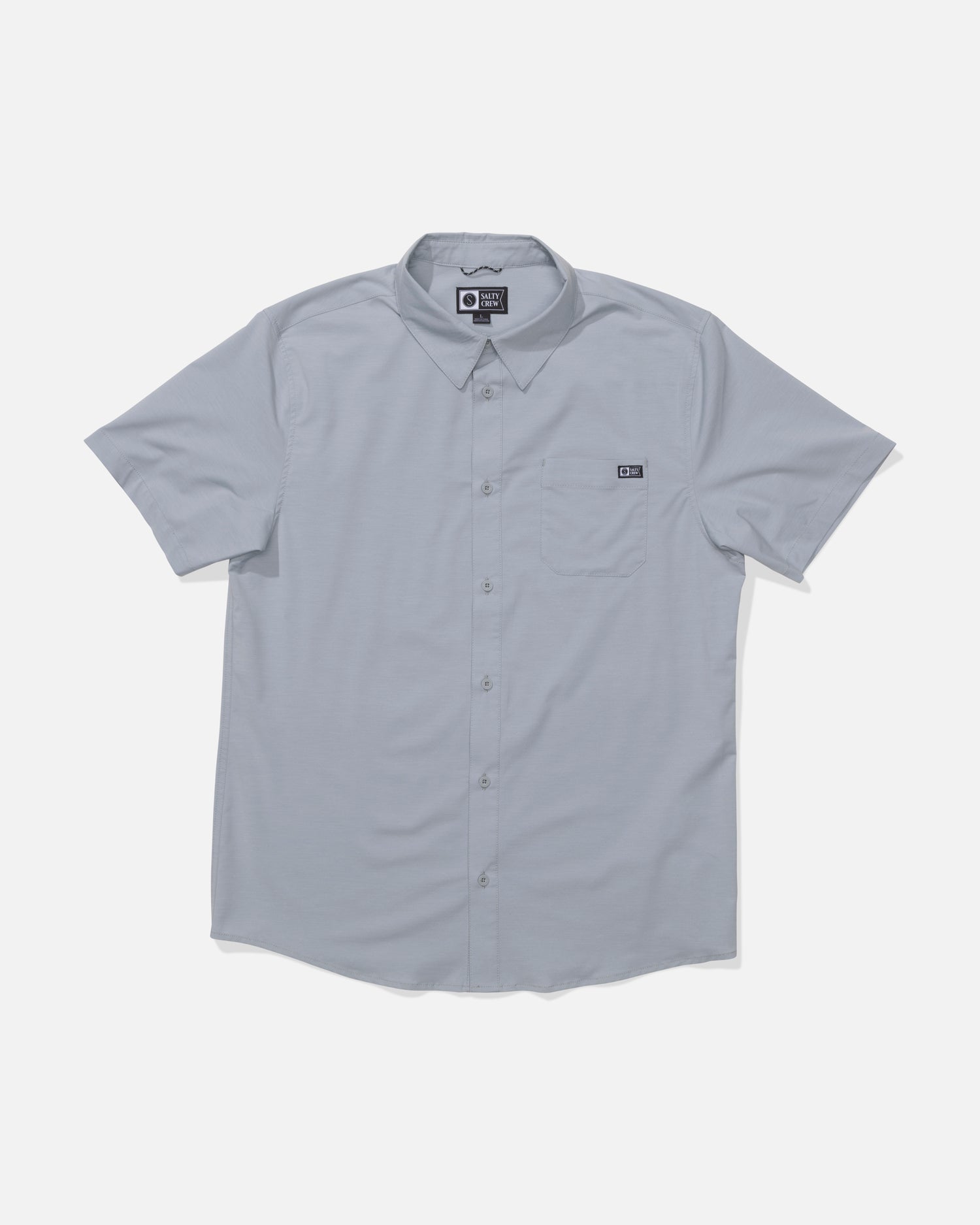The Salty Crew Drifter UV Button Up in Quarry is a light gray, short-sleeve shirt with a collar, left chest pocket, and small black tag. Made from moisture-wicking fabric, it is shown laid flat on a white background.