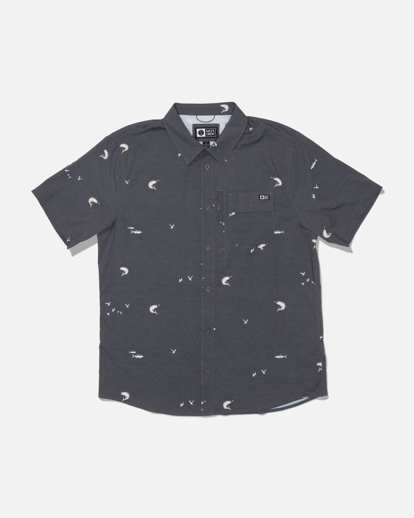 Introducing the Salty Crew Flagship UV Button Up in Dark Grey—a short-sleeve shirt featuring an all-over print with small white birds and fish. Designed with a front pocket and crafted from quick-dry, moisture-wicking fabric, this button-up keeps you comfortable even on the warmest days.