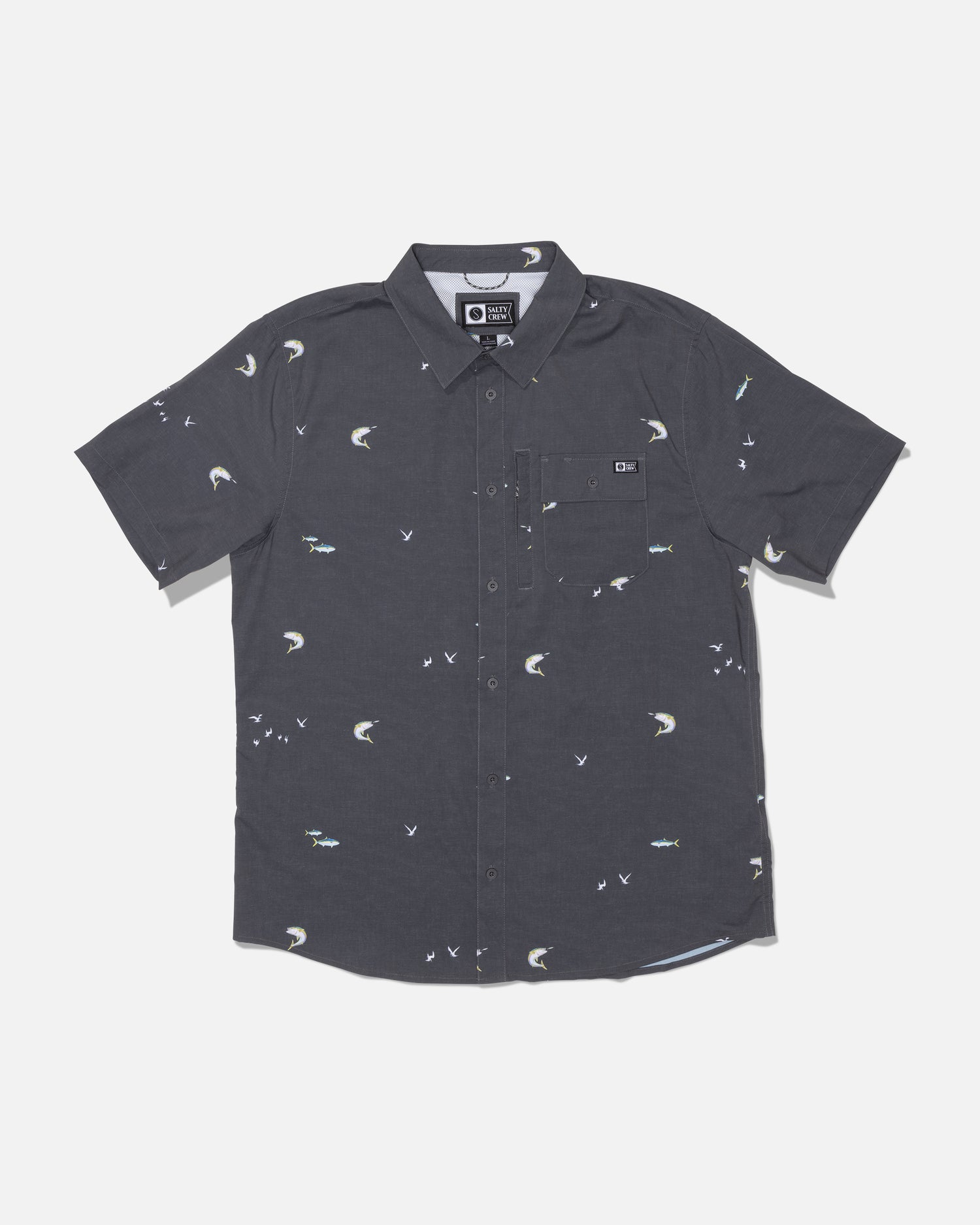 Introducing the Salty Crew Flagship UV Button Up in Dark Grey—a short-sleeve shirt featuring an all-over print with small white birds and fish. Designed with a front pocket and crafted from quick-dry, moisture-wicking fabric, this button-up keeps you comfortable even on the warmest days.