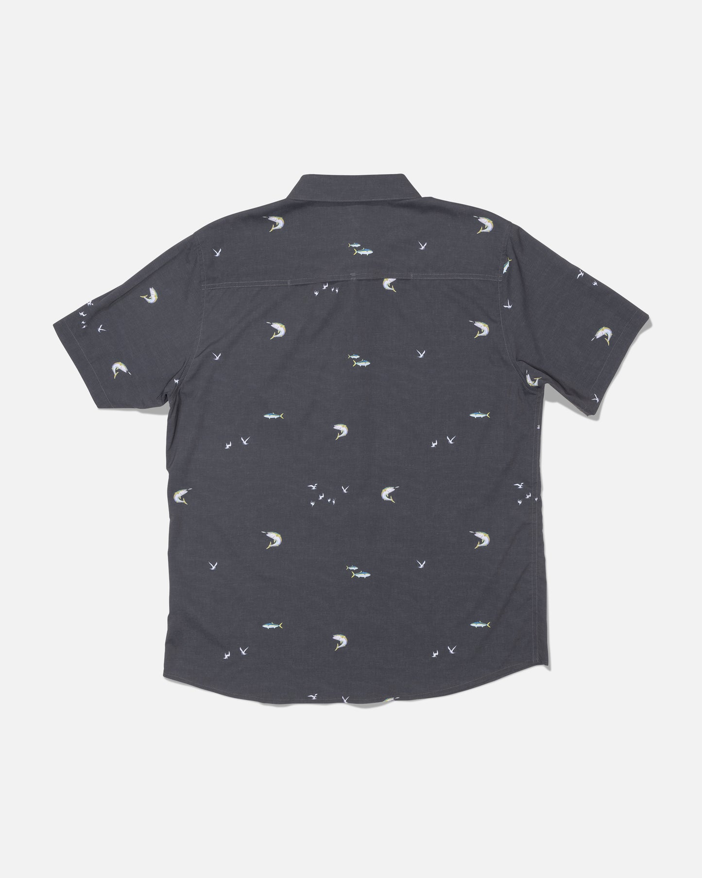 The Salty Crew Flagship UV Button Up in Dark Grey features small embroidered moons, birds, and fish scattered across the back. Crafted with quick-dry, moisture-wicking fabric that offers UPF 50+ sun protection, this short-sleeve shirt is designed to keep you cool and comfortable all day long. The shirt is displayed laid flat on a white background, showing the back side.