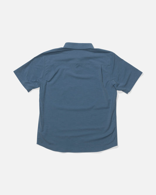 The Salty Crew Drifter UV Polo in Channel Blue is shown laid flat with the back facing up, featuring a straight yoke, relaxed fit, and UPF 50+ sun protection for comfortable outdoor wear.