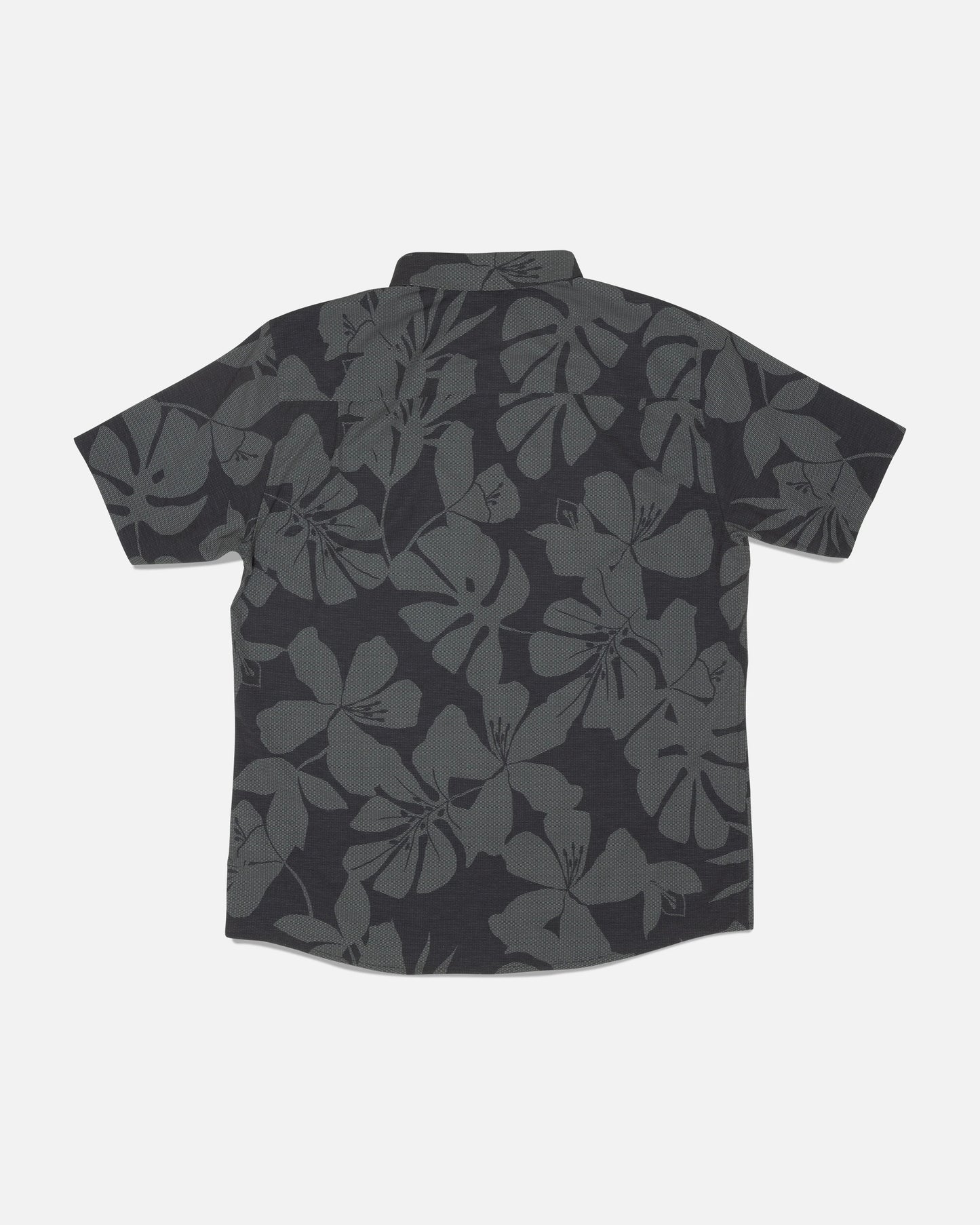 The Salty Crew Breezer Perforated Button Up - Black/Green features a short-sleeve design with a dark gray floral Hawaiian pattern on a black background, shown laid flat with the back facing up. Made from lightweight, breathable fabric for enhanced comfort.