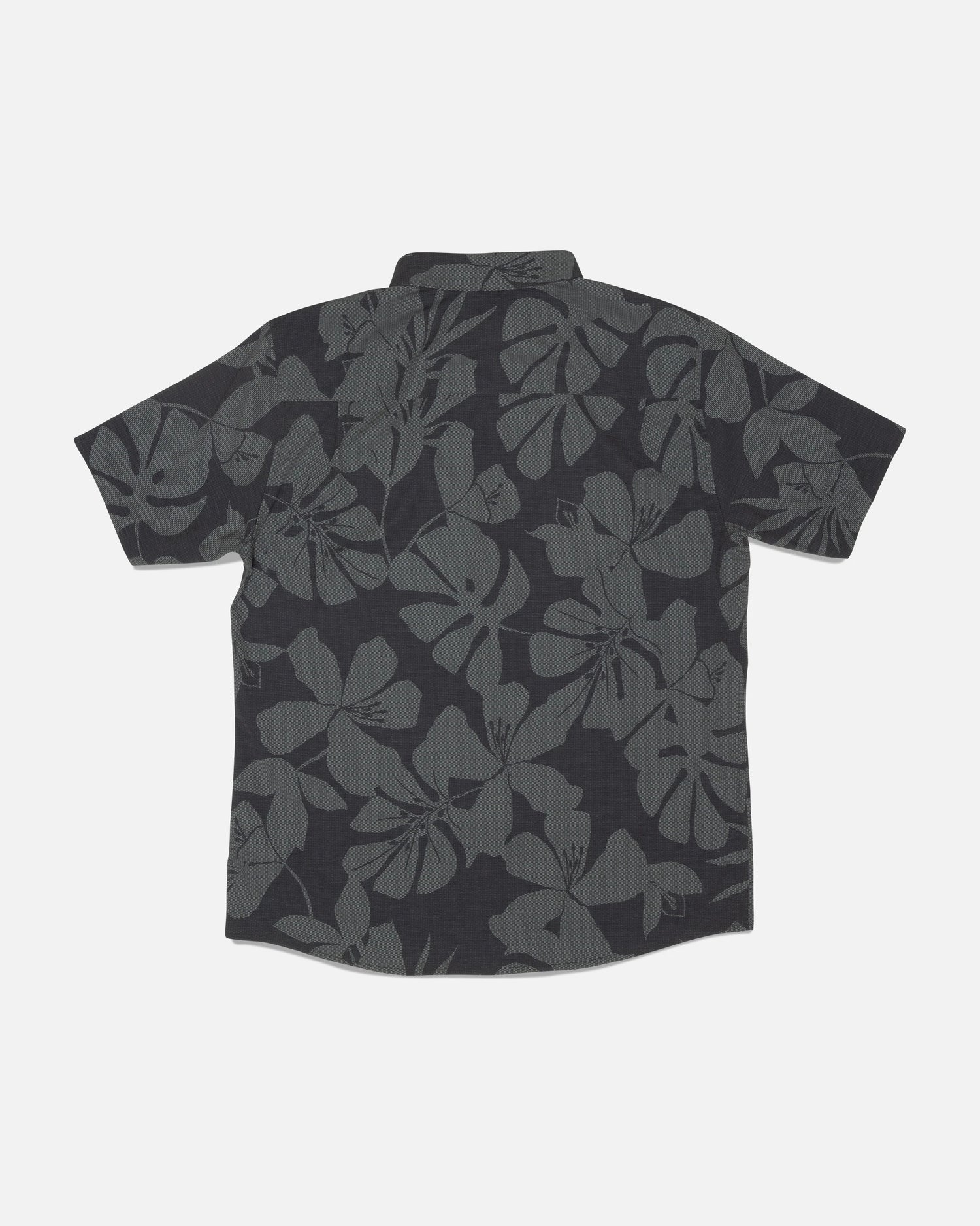 The Salty Crew Breezer Perforated Button Up - Black/Green features a short-sleeve design with a dark gray floral Hawaiian pattern on a black background, shown laid flat with the back facing up. Made from lightweight, breathable fabric for enhanced comfort.
