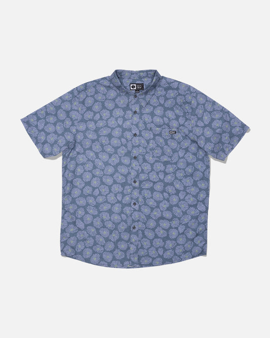 Salty Crew Crew Button Up in Hitch Blue—this short-sleeve cotton blend shirt features a light blue floral allover print, front chest pocket, and classic collar. Shirt is shown laid flat on a white background.