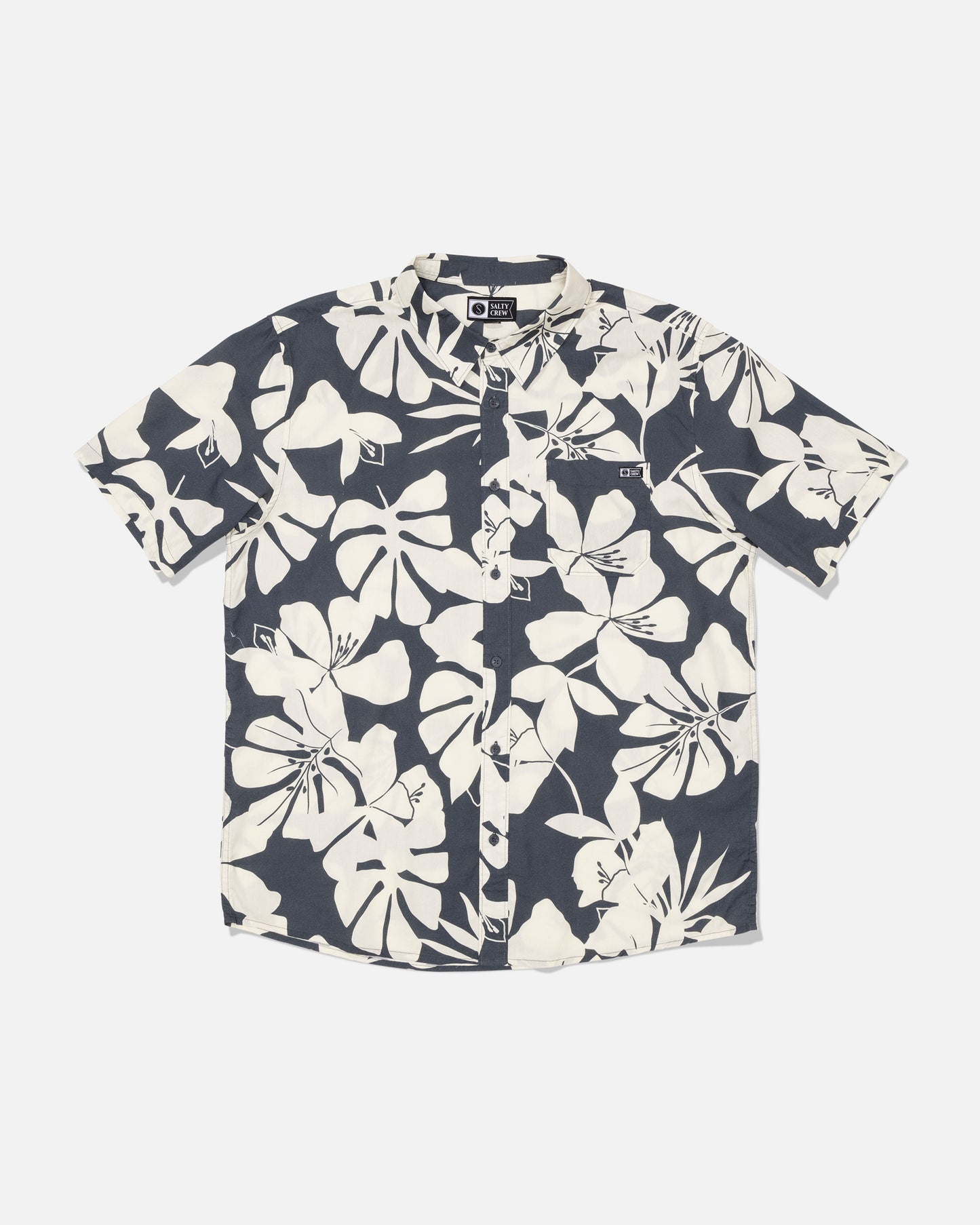 Salty Crew Crew Button Up - Iron: A short-sleeve button-up shirt made from a soft cotton blend, showcasing a bold white tropical allover print on a black background, displayed flat against a plain white surface.