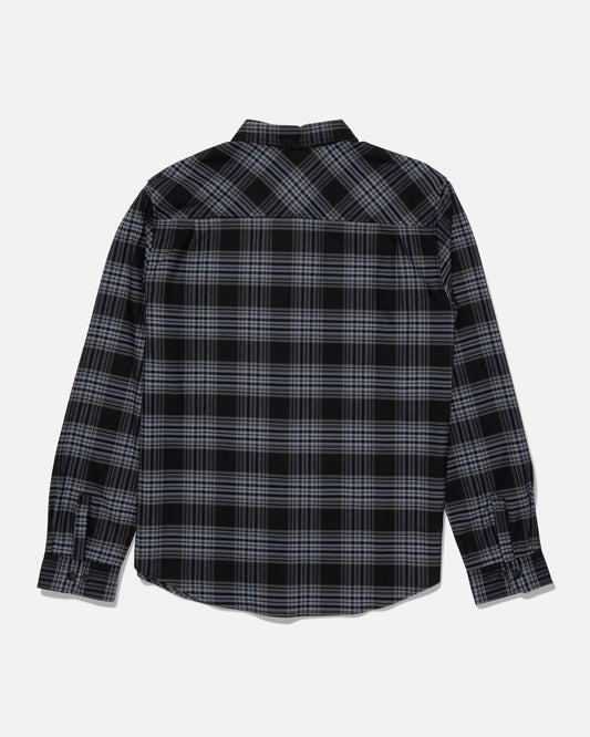 Salty Crew’s Fathom Tech Flannel - Dark Grey is a long-sleeve button-up shirt featuring a black and gray yarn-dyed plaid pattern, shown from the back against a white background.