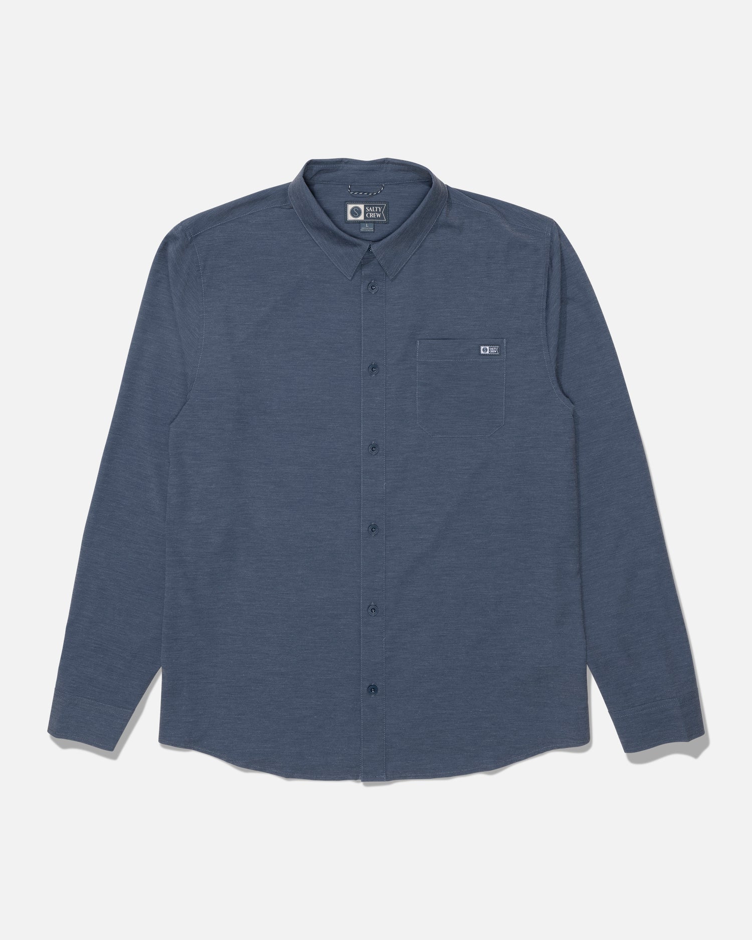 The Salty Crew Drifter Long Sleeve UV Button Up in Navy/Grey is laid flat on a white background. This shirt features a single chest pocket and is designed for comfort and performance, offering moisture-wicking and quick-dry properties to keep you cool and dry throughout the day.