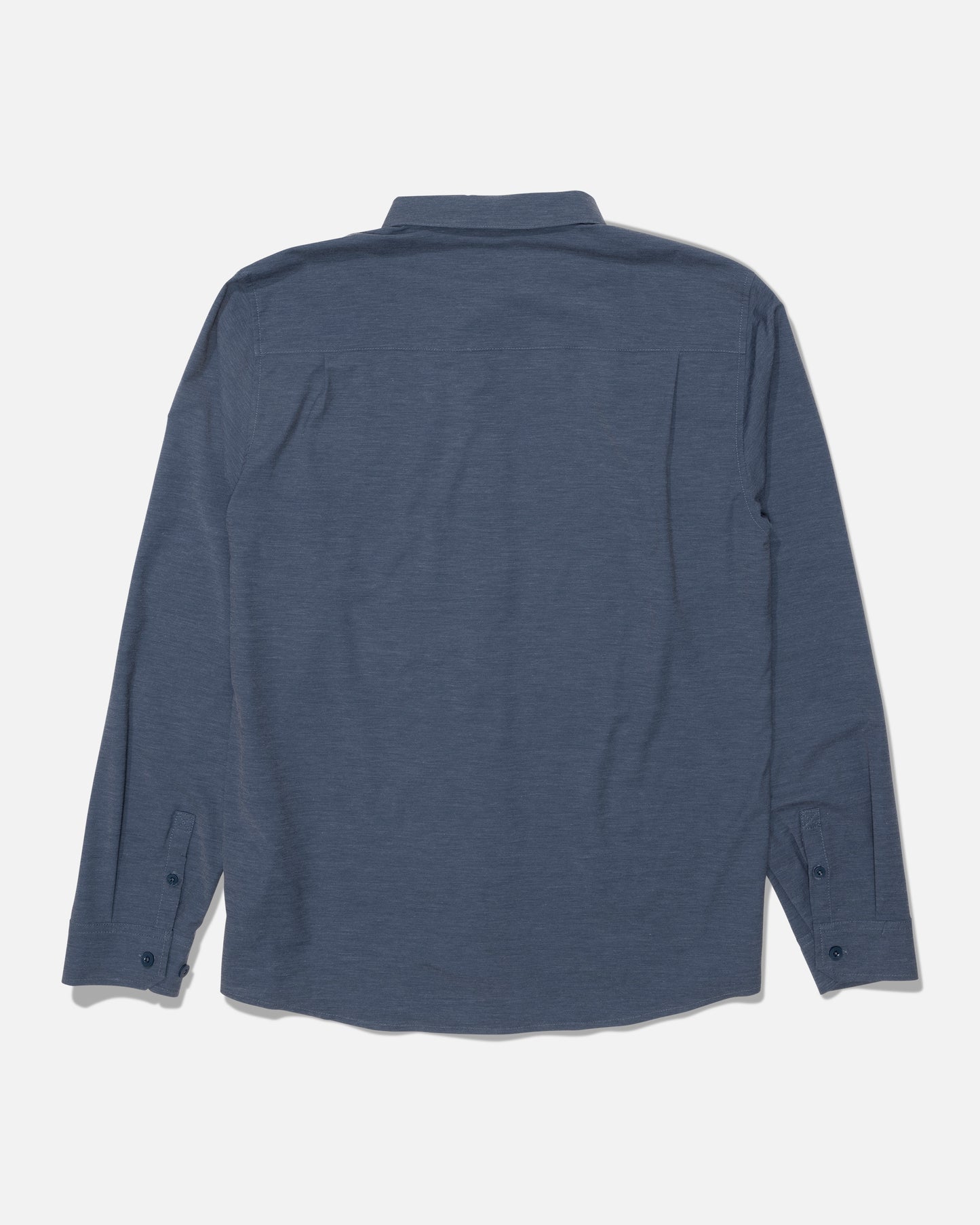 A Salty Crew Drifter Long Sleeve UV Button Up in navy/grey is laid flat with the back side facing up, showcasing a simple design with a collar and button cuffs, free from visible patterns or logos. Made with moisture-wicking fabric, this shirt keeps you comfortable all day long.