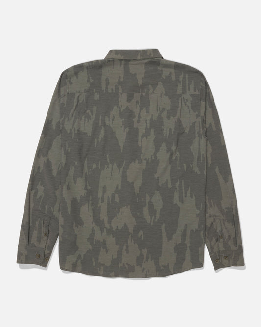 The Salty Crew Drifter Long Sleeve UV Button Up - Ranger is shown from the back against a white background, featuring a green and brown camouflage pattern, button-up front, and UPF 50+ sun protection for comfortable wear outdoors.