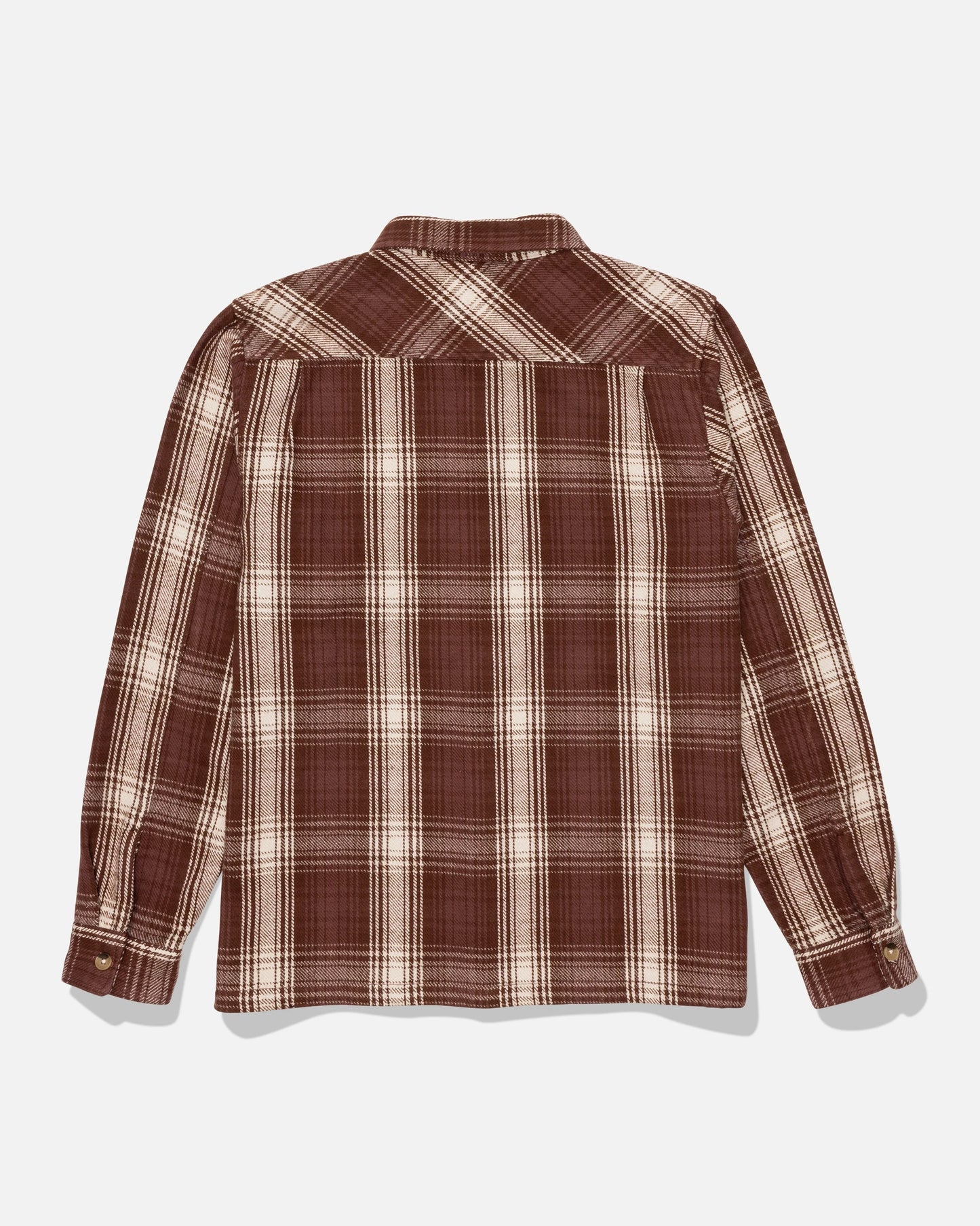 The Salty Crew Windward Flannel - Deep Brown is a long-sleeve, button-up shirt made from heavyweight cotton twill with a brown and beige plaid pattern. Shown from the back against a white background, it features classic chest pockets and an authentic garment wash for enhanced comfort and style.