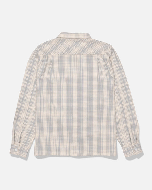 The Salty Crew Windward Flannel in Off White, crafted from heavyweight cotton twill and garment-washed for extra softness, is displayed from the back on a plain white background; this long-sleeve shirt features button cuffs and a plaid pattern in light blue and beige tones.