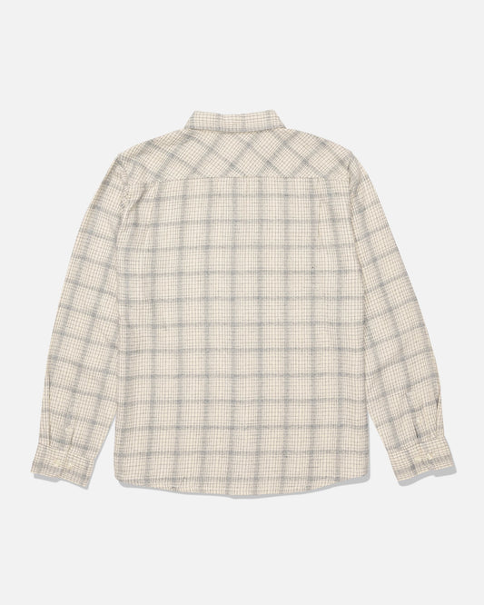 The Salty Crew Fine Line Flannel - Birch, a long-sleeve button-up shirt featuring a light beige and gray checkered pattern in soft cotton twill, is laid flat to display the back side against a white background.