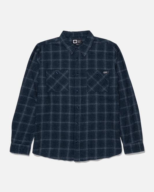 The Salty Crew Fine Line Flannel - Navy is a long-sleeve, button-up flannel shirt in dark blue and black plaid, featuring two chest pockets and displayed flat on a white background.
