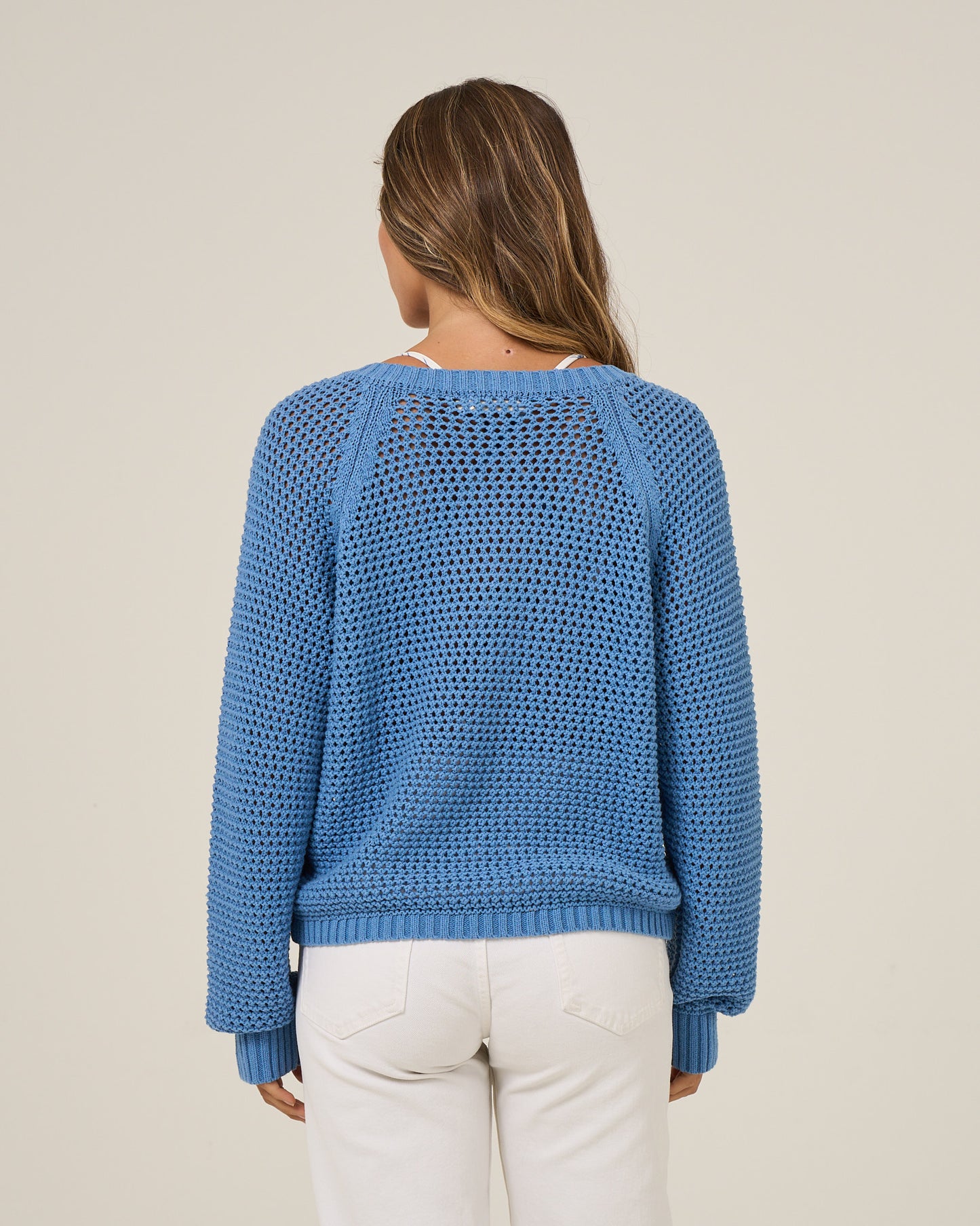 Back view of the Surge Sweater - Ash Blue. 