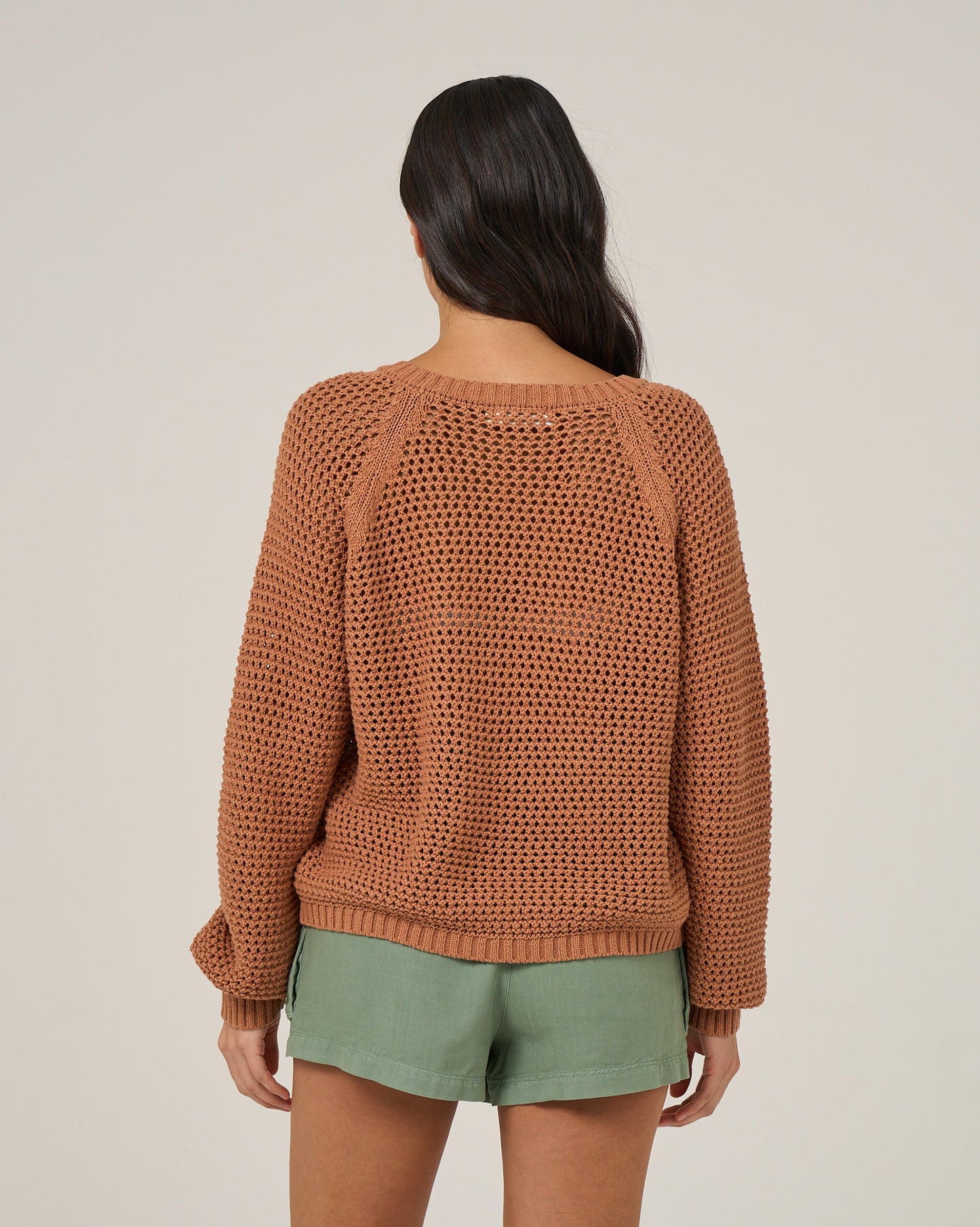Back view of the Surge Sweater - Mocha. 