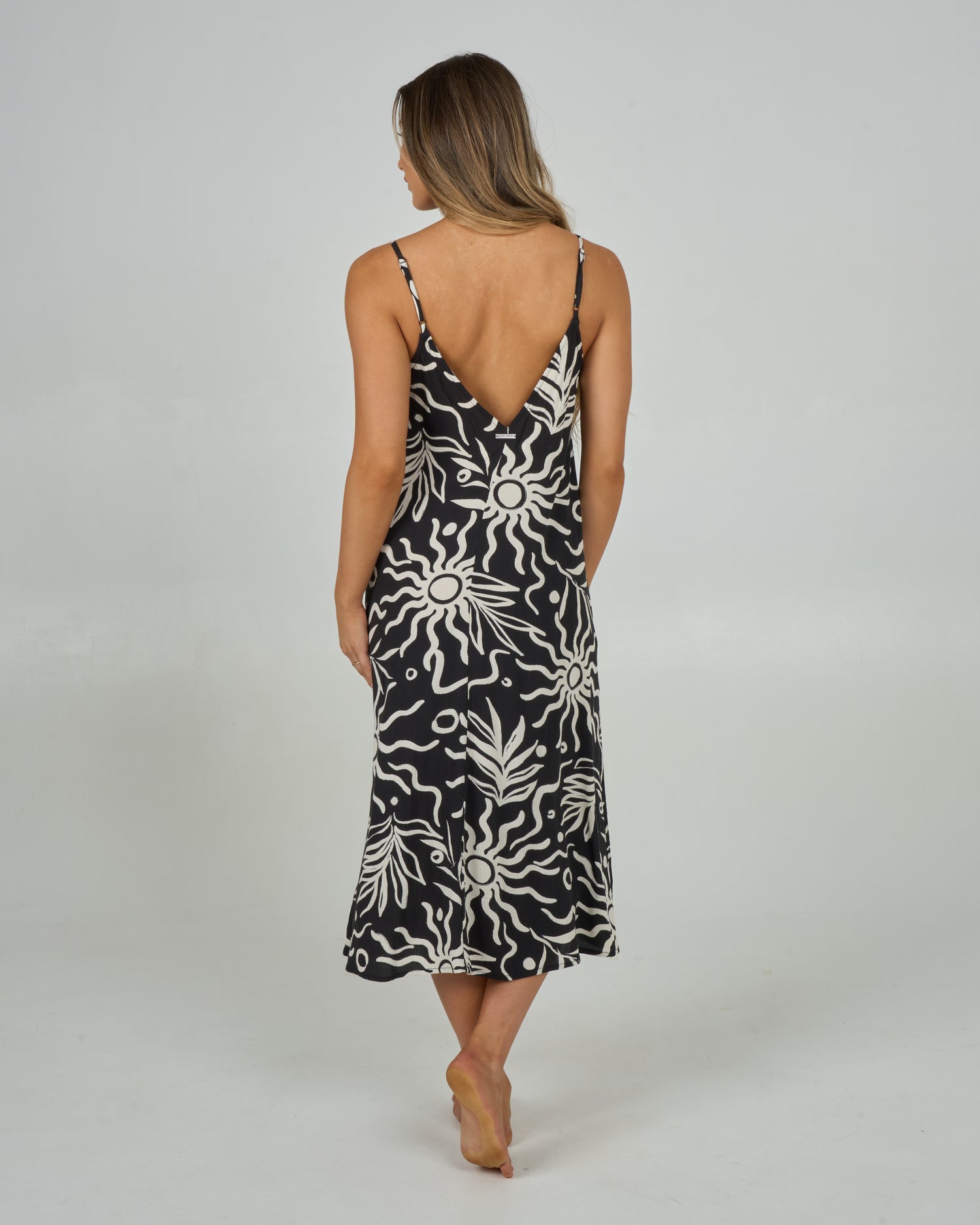 Back view of the Sunrise Midi Dress - Black. 