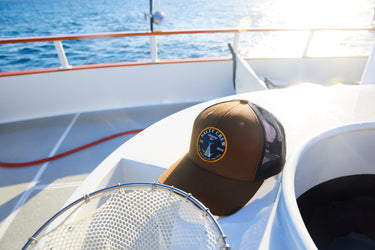 Shot of Salty Crew hat on a fishing boat 