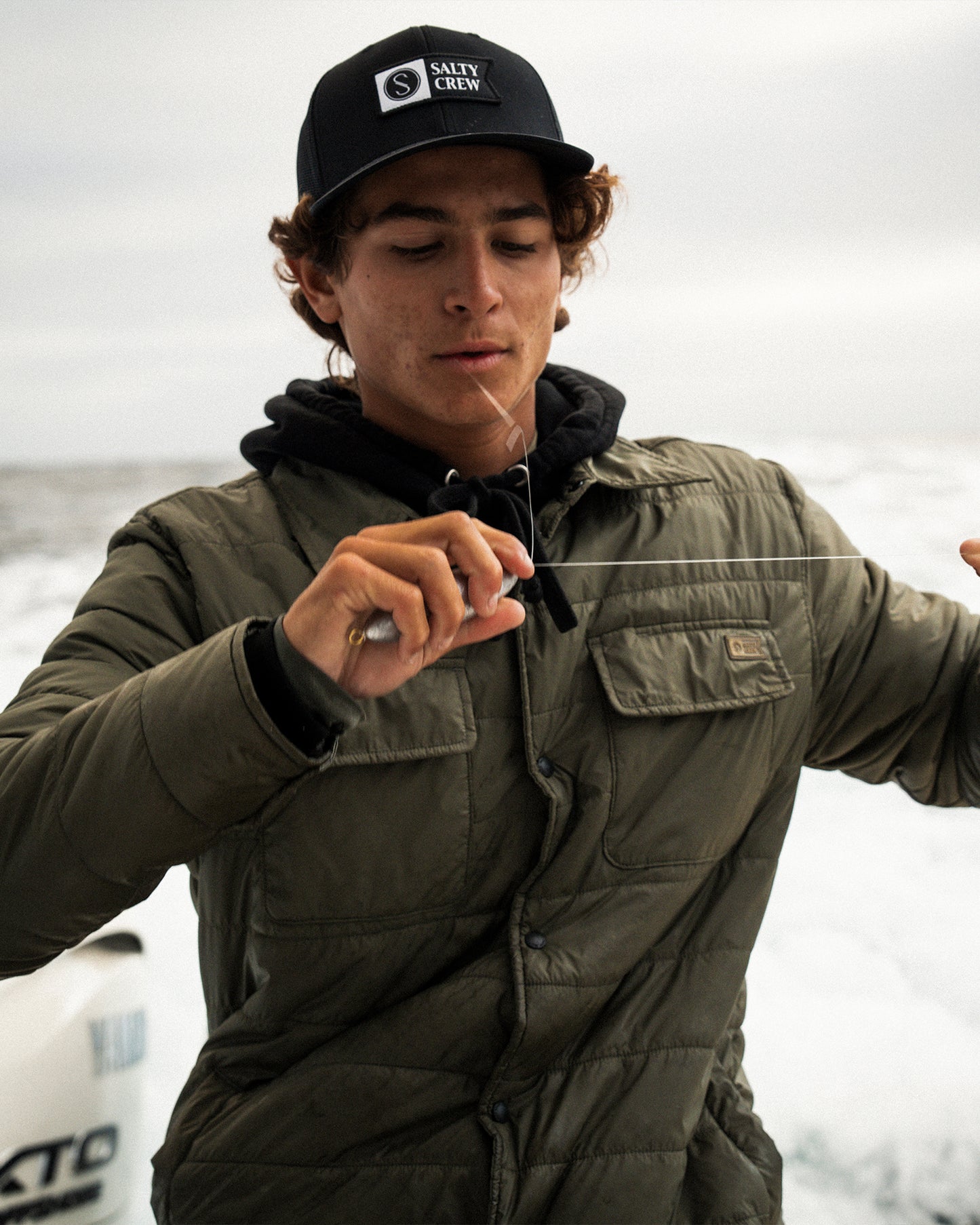 Lifestyle shot of the Barrier Shacket - Olive. 