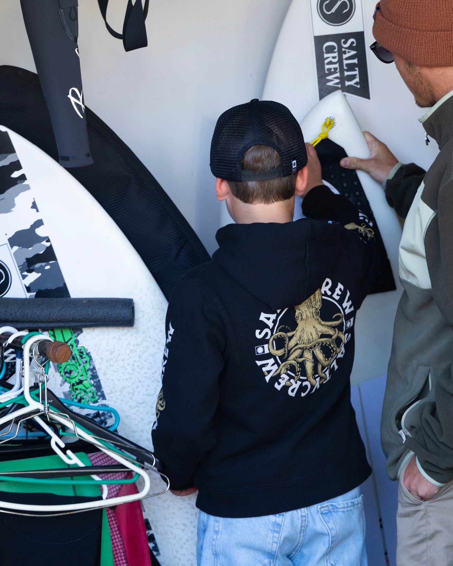 Lifestyle photo of the Tentacles Boys Fleece Hoodie - Black. 