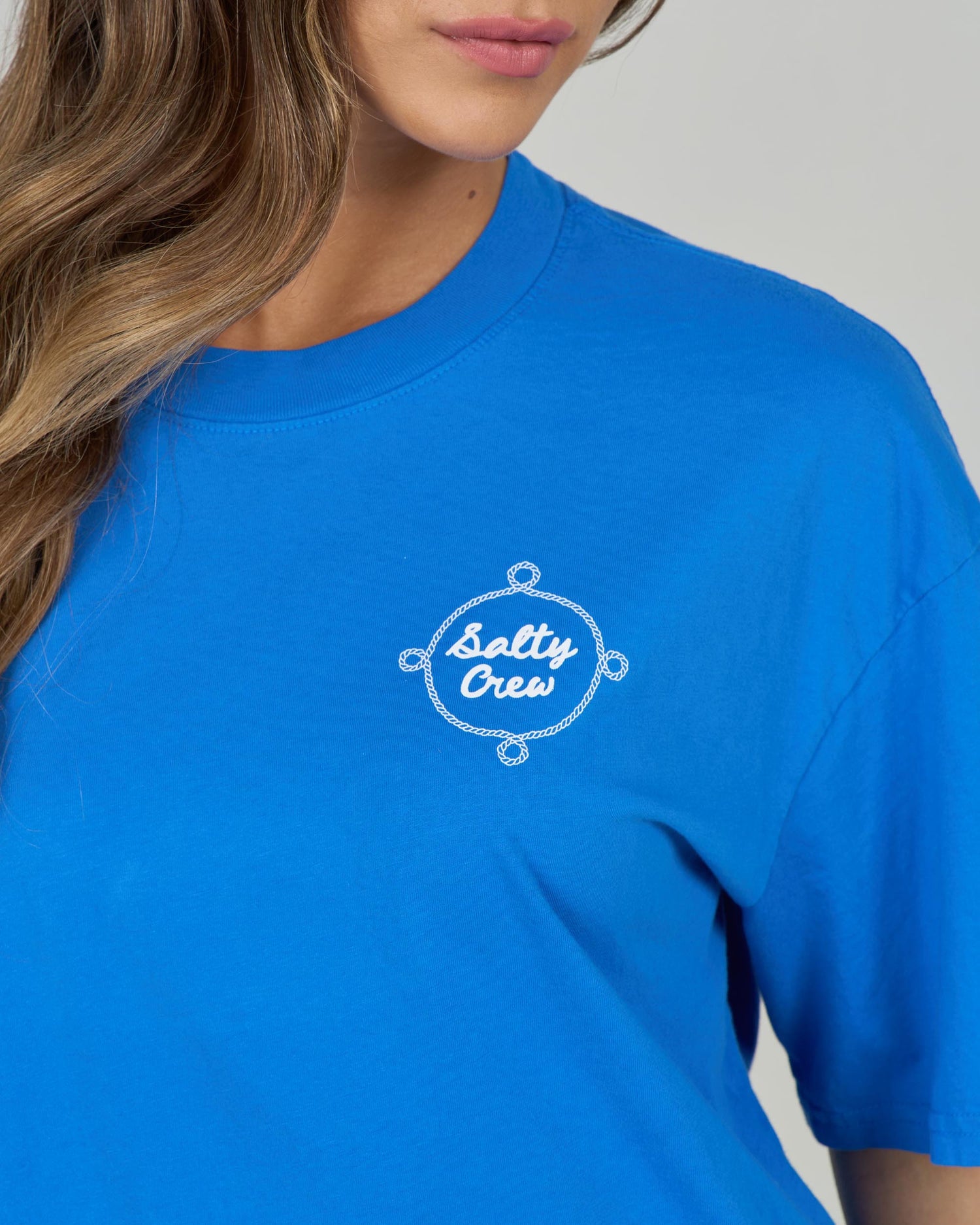 Close up front view of the Shellbrate Skimmer Tee - Bold Blue. 
