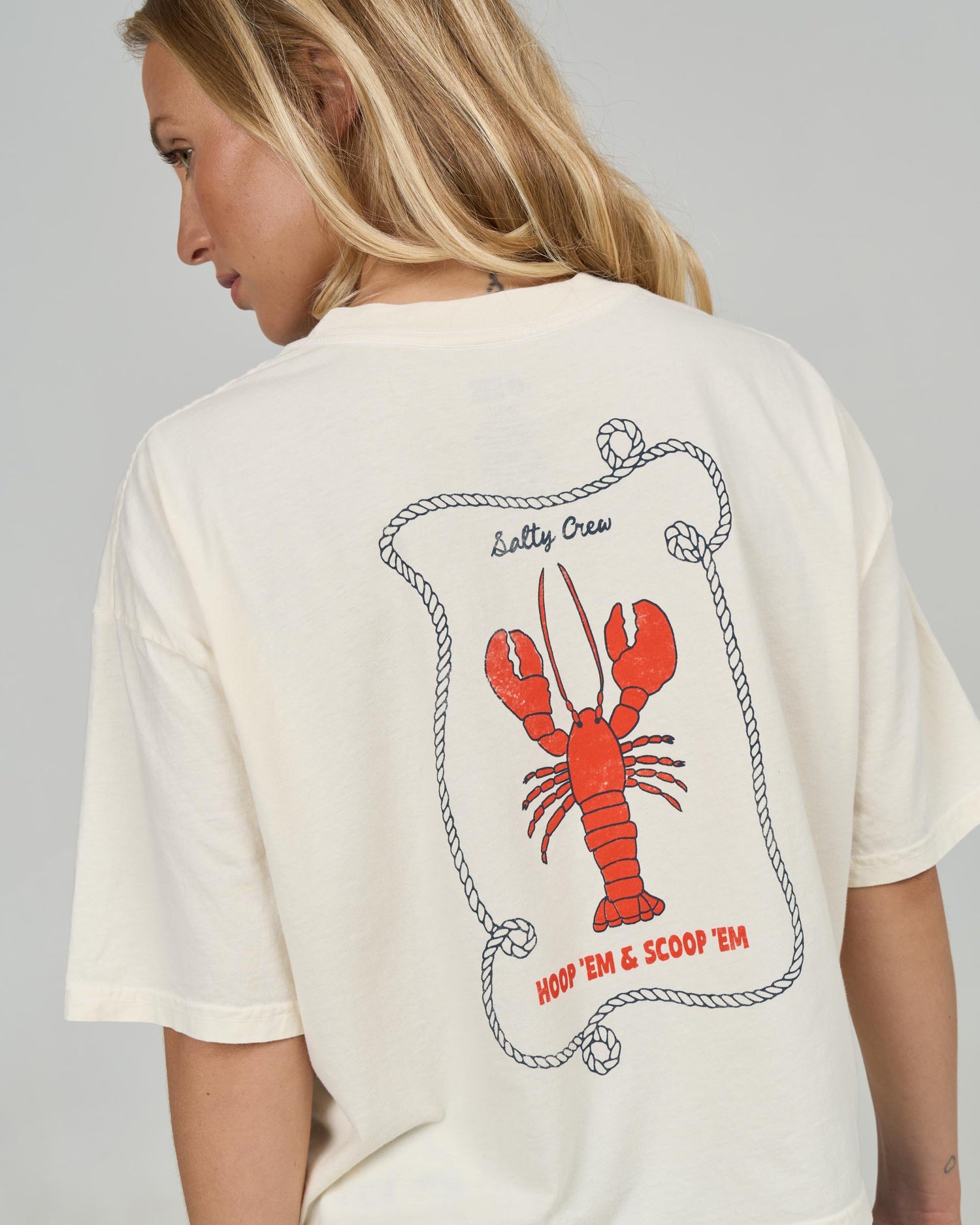 Close up back view of the Shellbrate Skimmer Tee - Off White. 