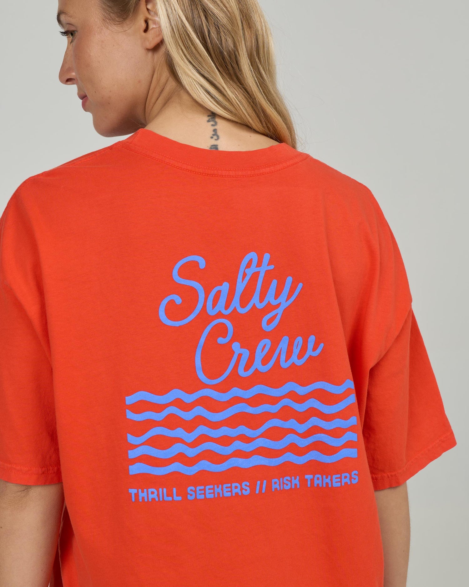 Detail back view of the Salty Skimmer Tee - Chili Pepper. 