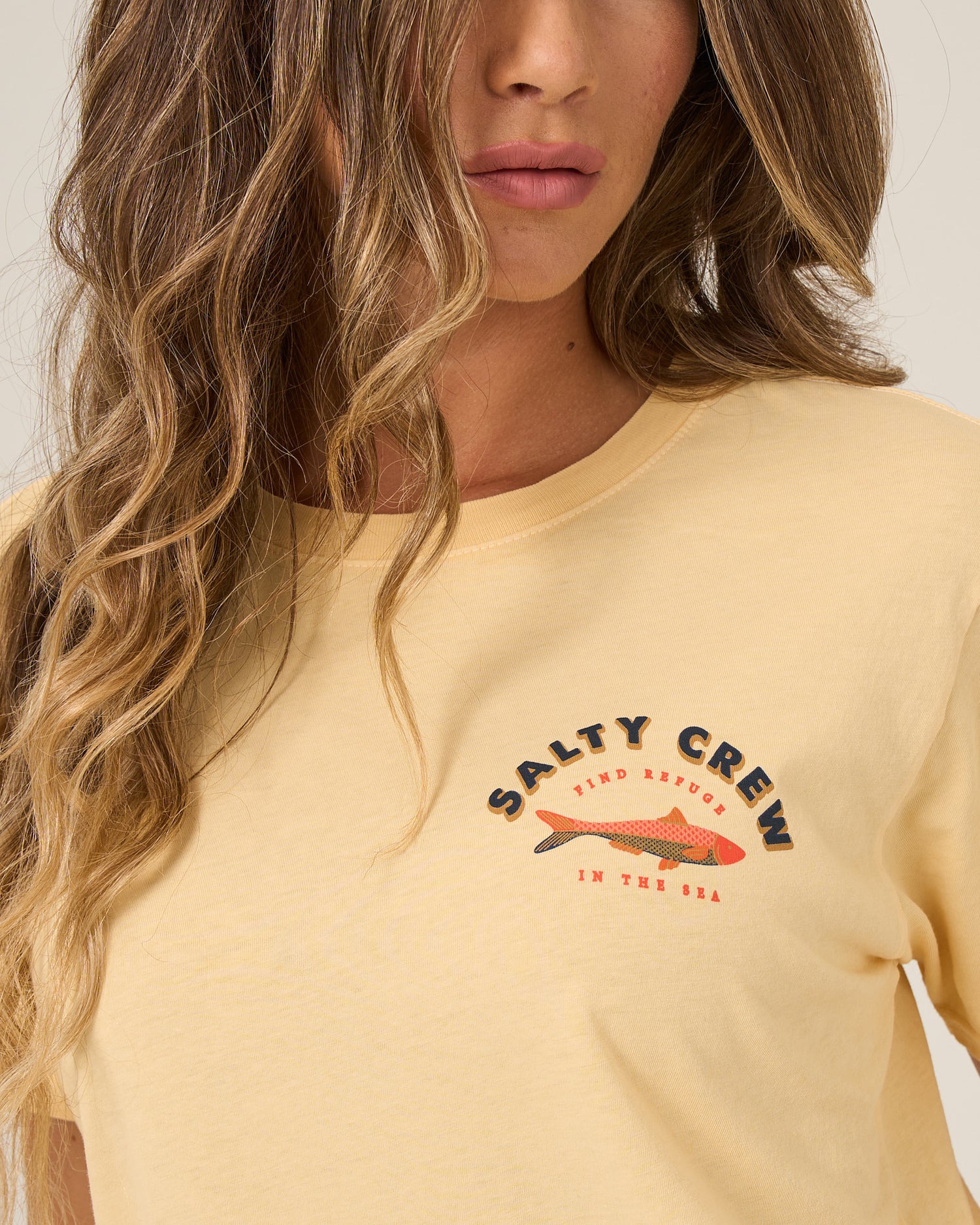 Close up front view of the Salty Sardine Boyfriend Tee - Custard. 