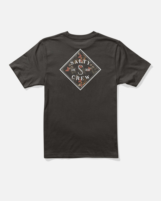 The Salty Crew Tippet Fill Boys Tee in black is made from combed ringspun cotton and features a diamond-shaped Salty Crew logo with fish graphics screenprinted on the back. The design showcases the words “Sink and Swim” along with bold marine motifs.