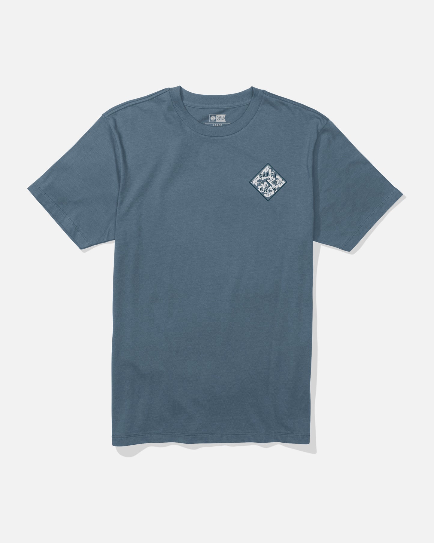 Salty Crew Tippet Fill Crew Tee in Slate Blue, a short-sleeve cotton t-shirt featuring a small white and blue diamond-shaped mountain graphic screenprinted on the left chest. The shirt is laid flat on a white background.