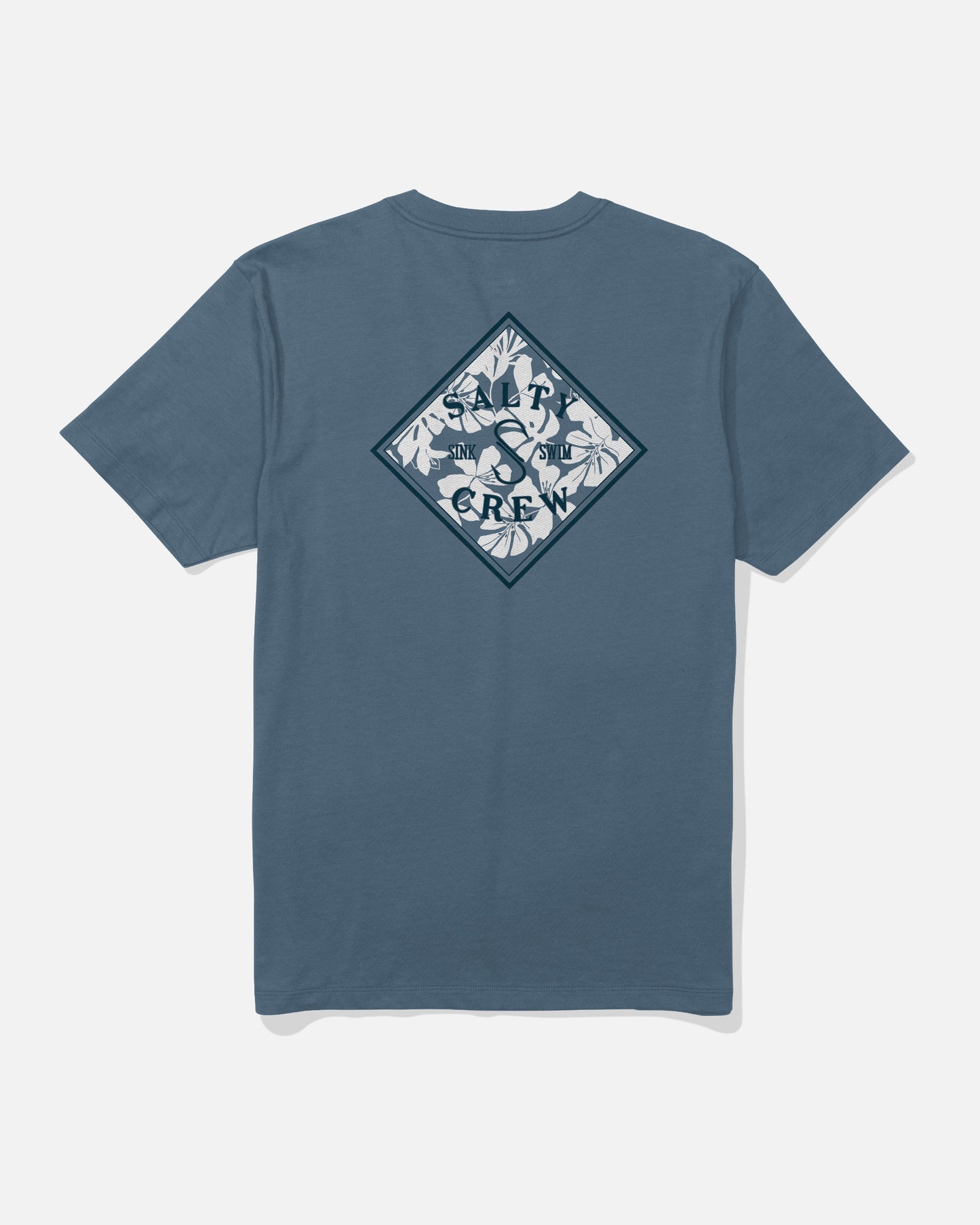 The Salty Crew Tippet Fill Crew Tee in Slate Blue is crafted from soft combed ringspun cotton for all-day comfort. This tee features a diamond-shaped, screenprinted back graphic with white leaves and the words “SHARK CREW” in dark blue, arranged around a shark silhouette.