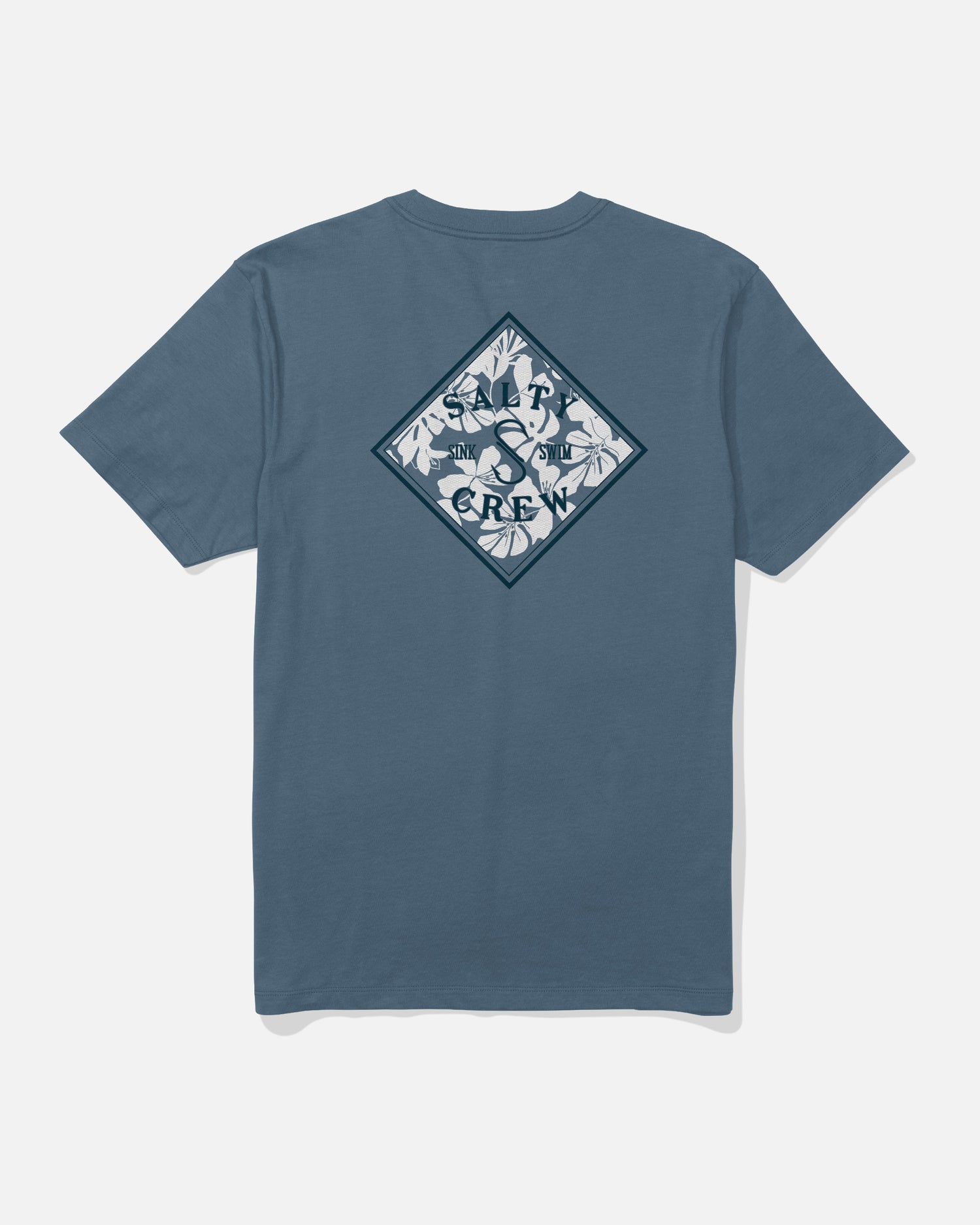 The Salty Crew Tippet Fill Crew Tee in Slate Blue is crafted from soft combed ringspun cotton for all-day comfort. This tee features a diamond-shaped, screenprinted back graphic with white leaves and the words “SHARK CREW” in dark blue, arranged around a shark silhouette.