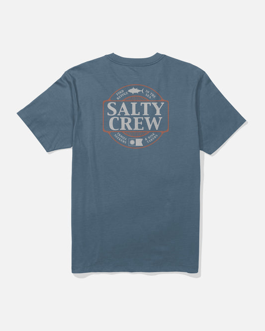 The Split Up Crew Tee - Slate by Salty Crew is a blue, short-sleeve, screenprinted cotton t-shirt featuring a bold Salty Crew back graphic in large letters, encircled by a fish design with text below. Made from soft combed ringspun fabric for all-day comfort.