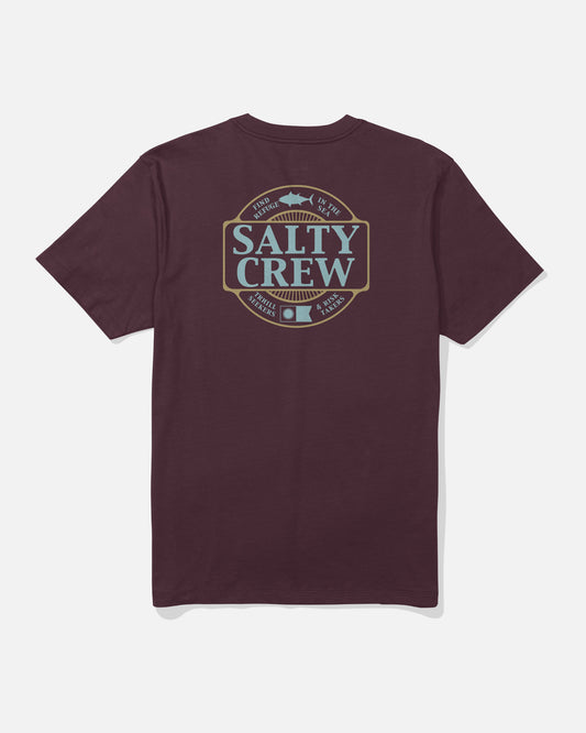 The Salty Crew Split Up Crew Tee in Wine is a combed ringspun cotton t-shirt featuring a large back graphic with blue and tan Salty Crew branding, a fish illustration, and the phrases “Find Refuge In The Sea” and “Thrill Seekers & Risk Takers,” all screenprinted for vibrant, lasting detail.