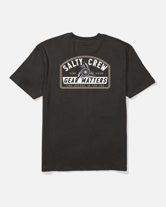 Introducing the Salty Crew Gear Shop Original Tee - Black, crafted from 100% cotton soft spun fabric for lasting comfort and durability. This t-shirt features a striking screenprinted back graphic that reads “Salty Crew Gear Matters” and “Find Refuge in the Sea,” highlighted by a bold nautical wheel illustration.