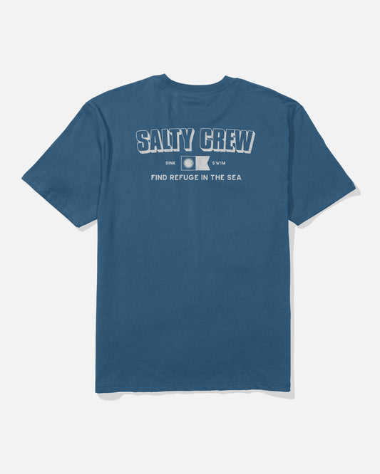 The Simple Original Tee - Cast Blue by Salty Crew is a blue, soft spun cotton t-shirt featuring the SALTY CREW logo screenprinted in bold white letters on the back, above a small graphic and the phrase “FIND REFUGE IN THE SEA.” The shirt is displayed flat against a white background.