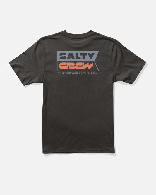 The Salty Crew Inverse Flag Boys Tee in black features a bold flag-inspired graphic on the back, with large gray, orange, and blue lettering spelling SALTY CREW and “FIND REFUGE IN THE SEA” screenprinted below.