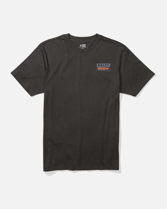 The Inverse Flag Crew Tee by Salty Crew is a plain black combed ringspun cotton t-shirt featuring a small rectangular Salty Crew logo in blue, red, and white screenprinted on the upper left chest. The shirt is shown against a white background.