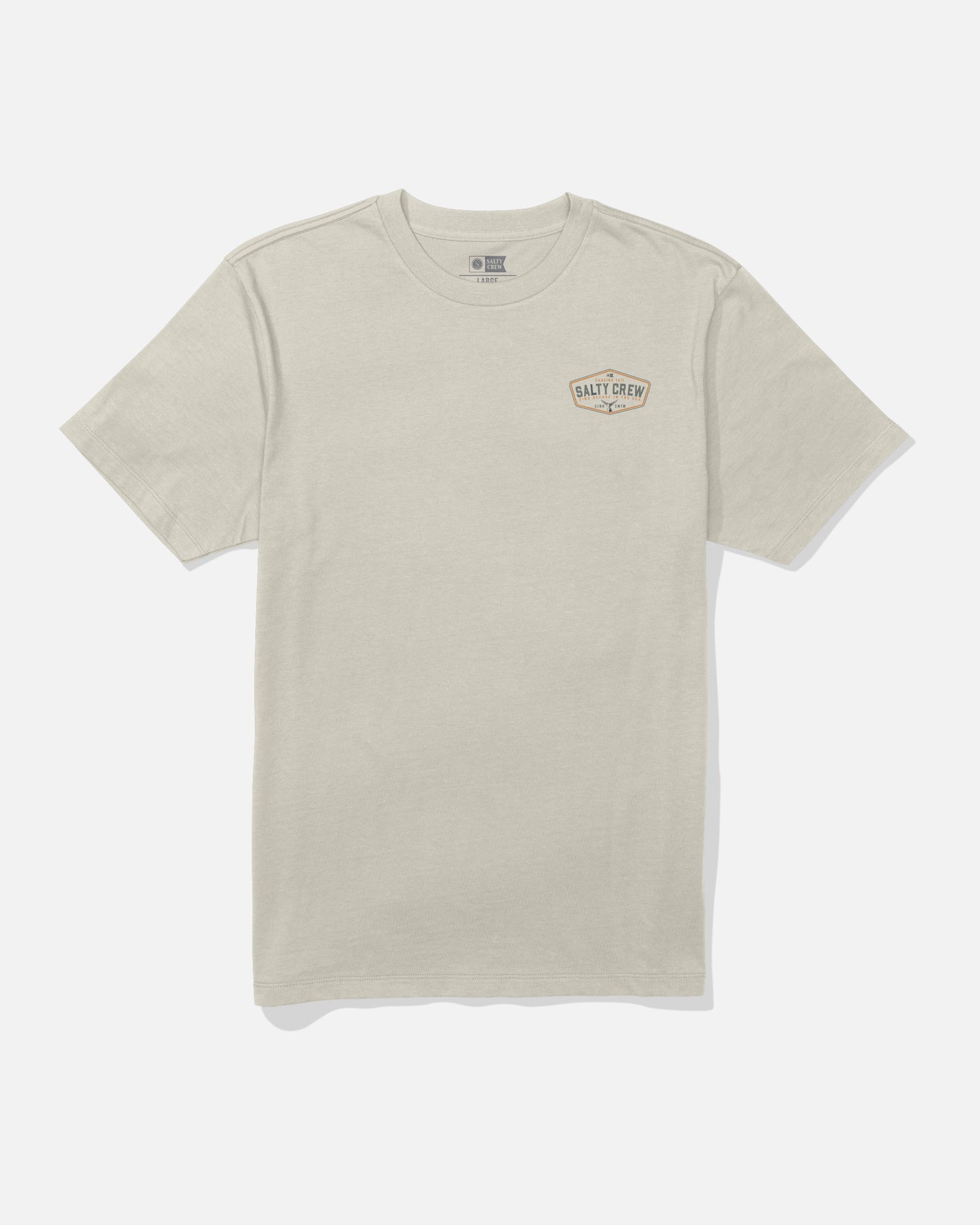 The Salty Crew Tailfin Crew Tee in Bone is a beige short-sleeve t-shirt featuring a small Salty Crew logo on the left chest. Made from soft combed ringspun cotton, this tee is shown laid flat on a white background.